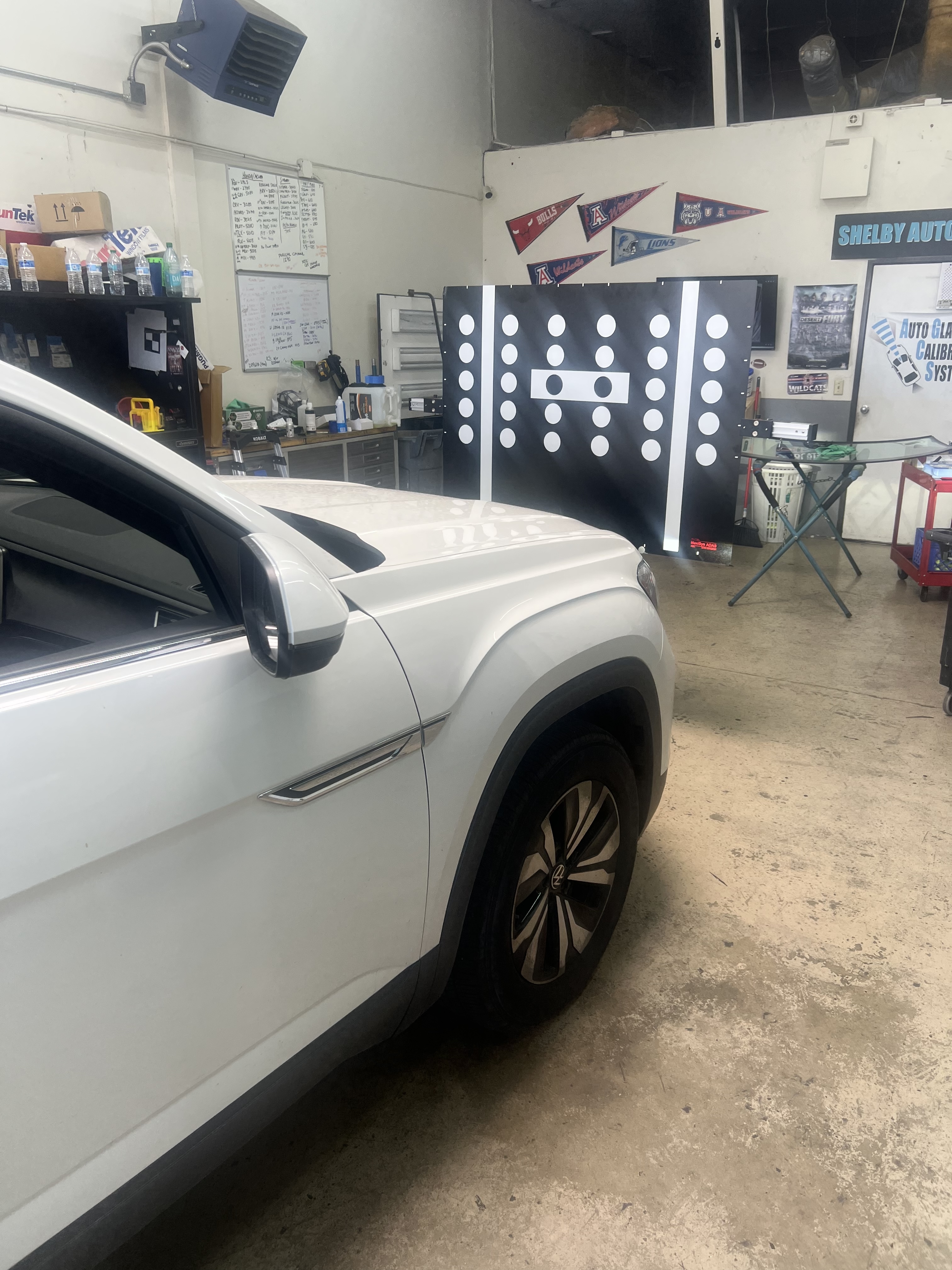 Shelby Auto Glass ADAS calibration target equipment positioned in front of a vehicle