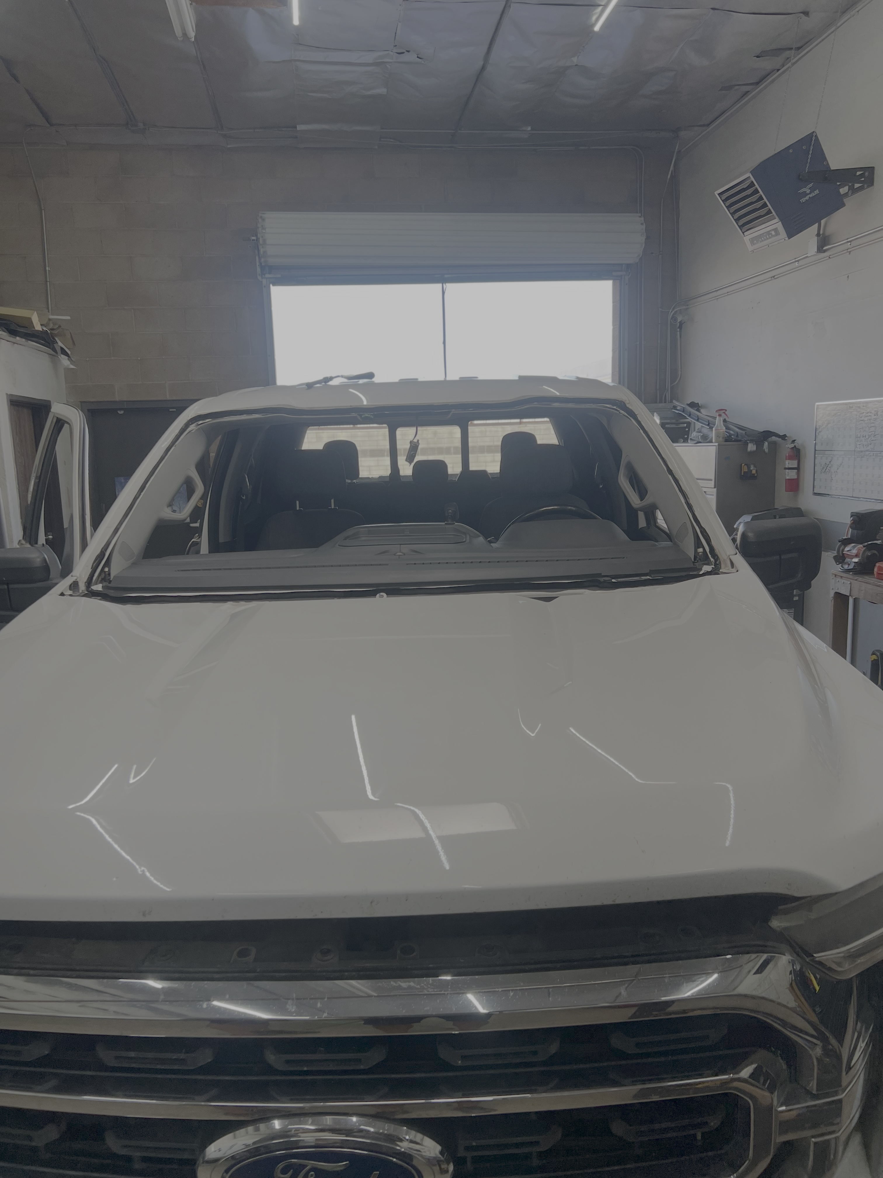 Windshield replacement underway inside the Shelby Auto Glass shop